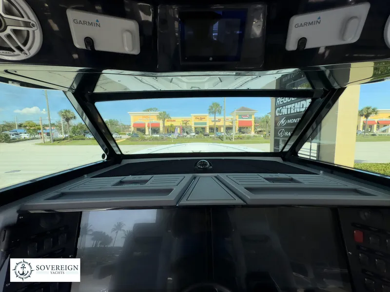 Slide: The Image of Interior view of 2024 Blackfin 400 boat dashboard with Garmin navigation system. - 42
