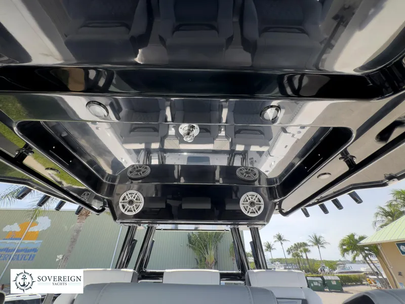 Slide: The Image of 2024 Blackfin 400 boat interior with sleek design and advanced audio system. - 45