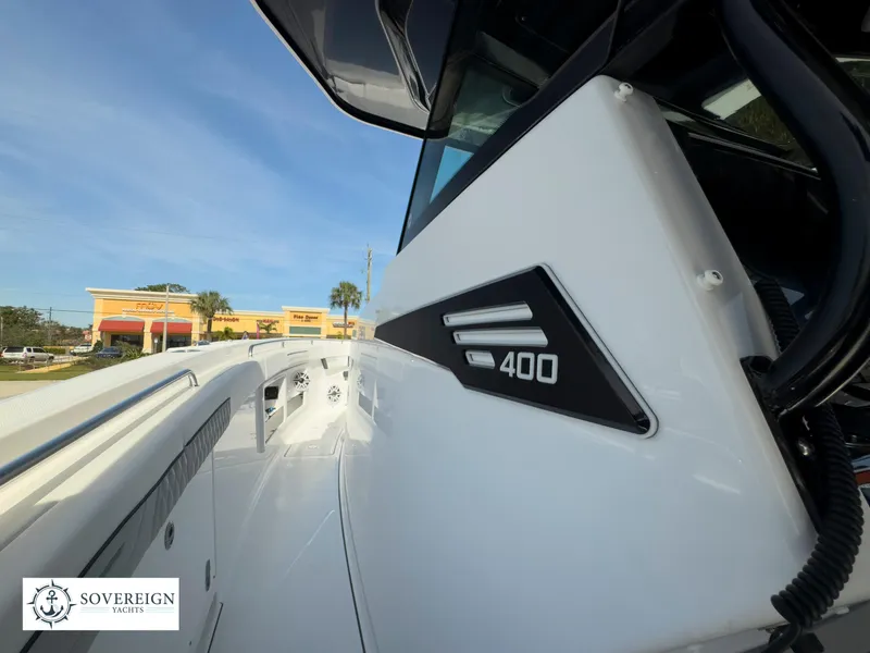 Slide: The Image of 2024 Blackfin 400 boat side view with Sovereign Yacht logo. - 46