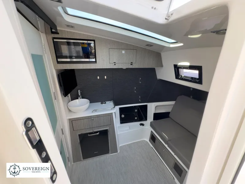 Slide: The Image of Interior cabin of 2024 Blackfin 400 boat with modern amenities and sleek design. - 47