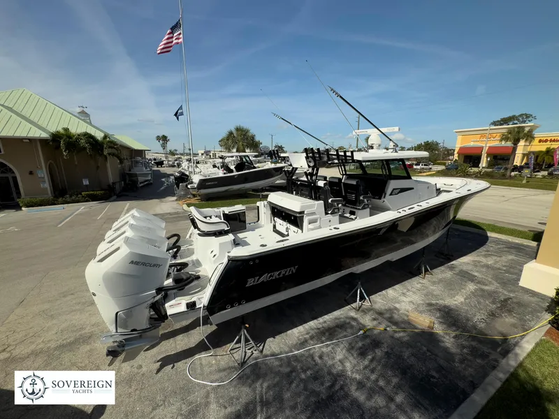Slide: The Image of 2024 Blackfin 400 boat on display at Sovereign Yacht dealership. - 6