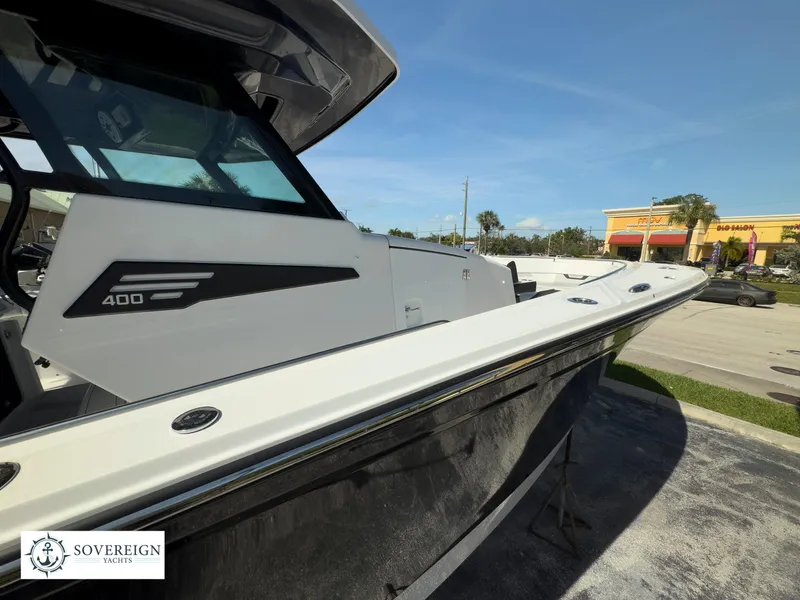 Slide: The Image of 2024 Blackfin 400 boat displayed outdoors on a sunny day. - 9