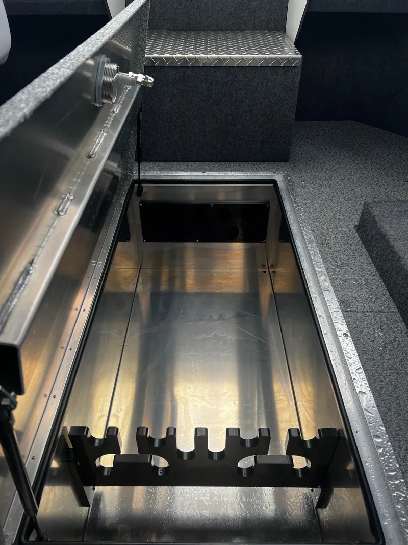 Slide: The Image of 2024 Thunder Jet 21 Chinook OS boat storage compartment with open lid. - 11