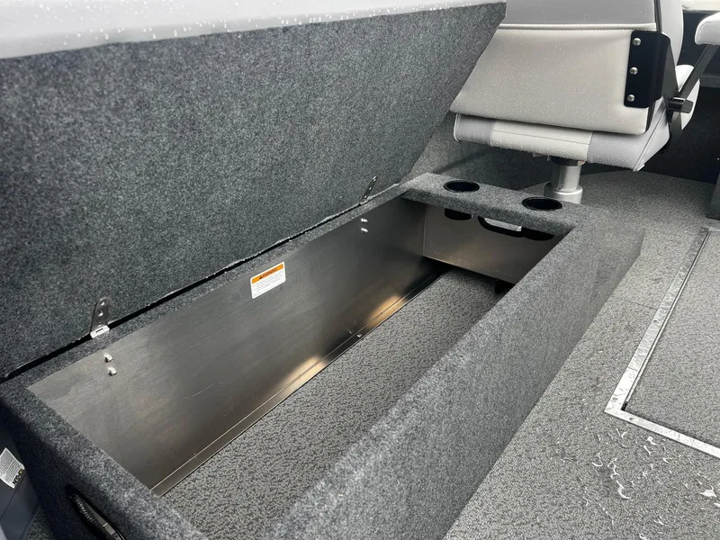 Slide: The Image of 2024 Thunder Jet 21 Chinook OS boat storage compartment with cup holders. - 12