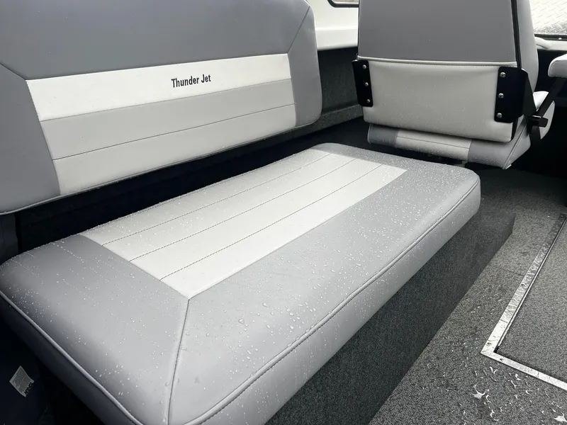 Slide: The Image of Interior seating of 2024 Thunder Jet 21 Chinook OS boat with grey and white upholstery. - 13