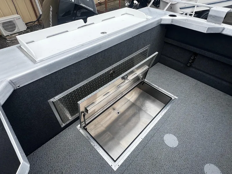 Slide: The Image of 2024 Thunder Jet 21 Chinook OS boat with open storage compartment. - 16