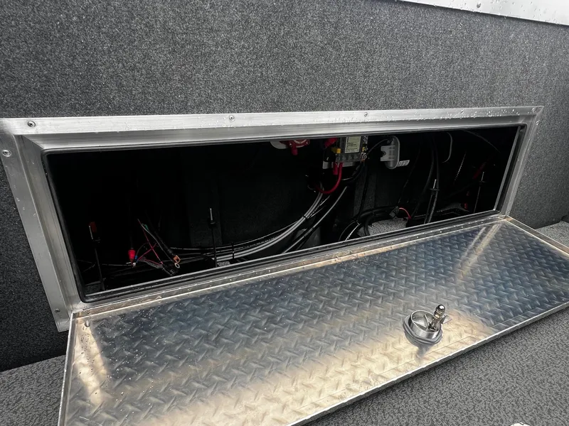 Slide: The Image of Open storage compartment in 2024 Thunder Jet 21 Chinook OS boat. - 17