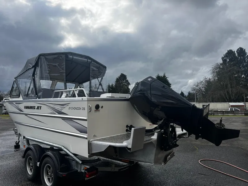 Slide: The Image of 2024 Thunder Jet 21 Chinook OS boat with outboard motor on trailer. - 3