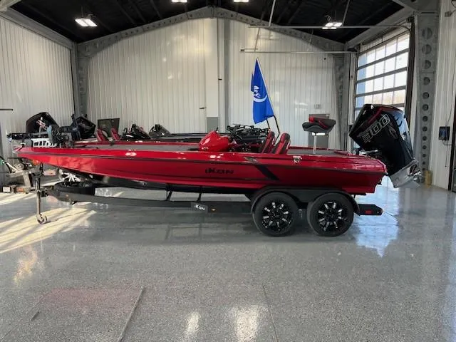The Image of Red 2024 iKon LX20 boat on trailer in a showroom. - 0