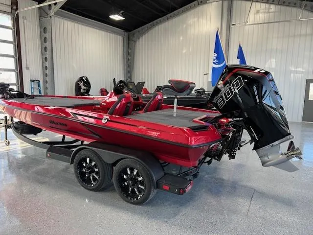 Slide: The Image of 2024 iKon LX20 red bass boat with 300 HP engine in showroom. - 3