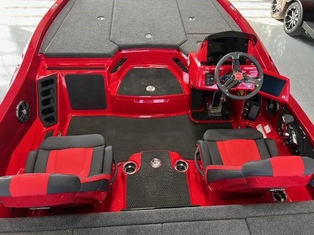 Slide: The Image of 2024 iKon LX20 boat interior with red and black seats and modern dashboard. - 9