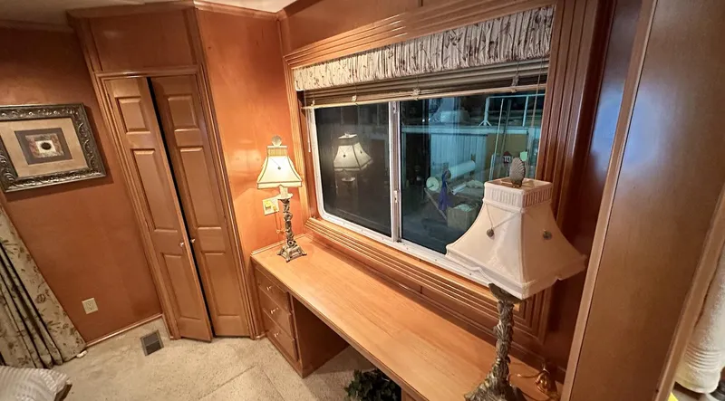 Slide: The Image of Cozy wooden interior with desk, lamps, and window in 2005 Fantasy 18 x 80 model. - 11