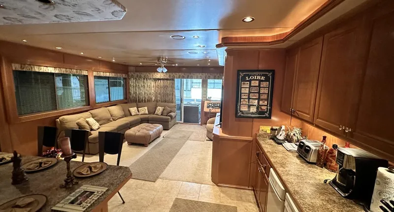 Slide: The Image of Luxurious interior of a 2005 Fantasy 18 x 80 houseboat with modern kitchen and spacious living area. - 24