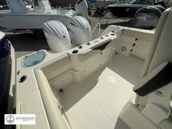 Slide: The Image of 2024 Sailfish 242 CC boat interior with Yamaha engines, spacious seating, and modern amenities. - 13