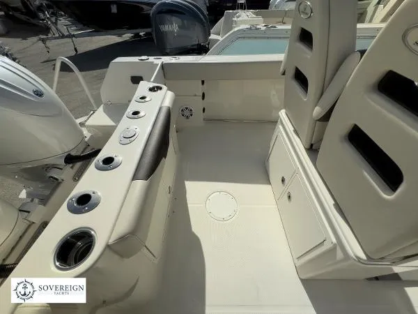 Slide: The Image of 2024 Sailfish 242 CC boat interior with seating and storage compartments. - 14