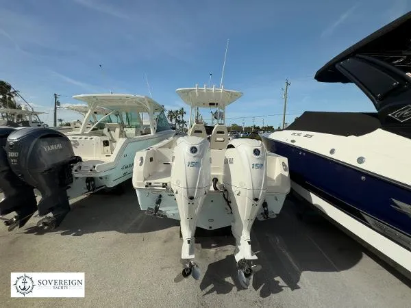 Slide: The Image of 2024 Sailfish 242 CC boat with twin outboard motors displayed at Sovereign Yachts. - 22