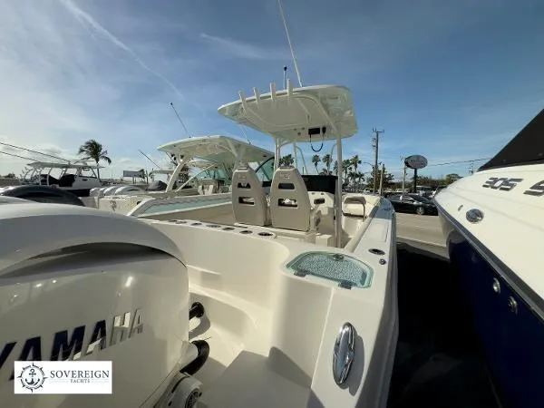 Slide: The Image of 2024 Sailfish 242 CC boat with Yamaha engine, displayed at Sovereign Yachts dealership. - 23