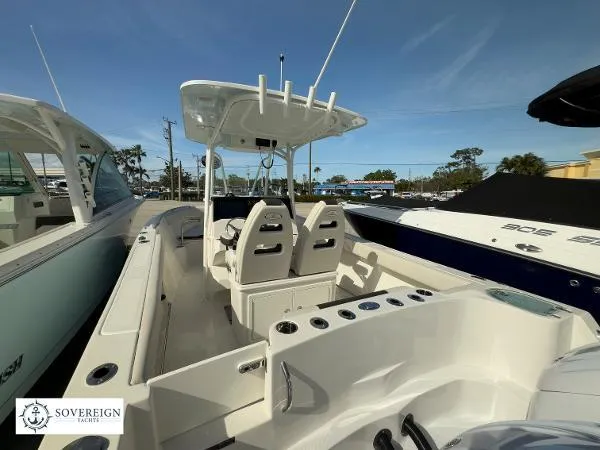 Slide: The Image of 2024 Sailfish 242 CC boat interior with dual seats and center console. - 25