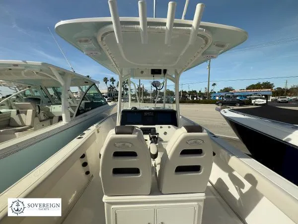 Slide: The Image of 2024 Sailfish 242 CC boat interior with dual seats and control panel, displayed at Sovereign Yacht. - 26