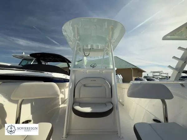 Slide: The Image of 2024 Sailfish 242 CC boat interior with seating and console, Sovereign Yacht branding visible. - 4