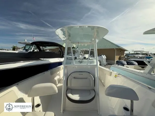 Slide: The Image of 2024 Sailfish 242 CC boat interior with seating and console, displayed at Sovereign Yachts. - 5