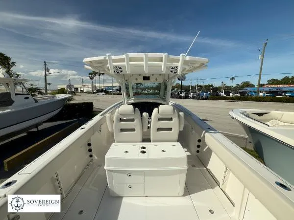 Slide: The Image of 2024 Sailfish 312 boat interior with dual seats and center console, displayed at Sovereign Yacht. - 12