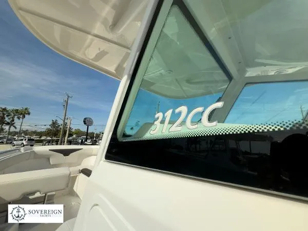 Slide: The Image of 2024 Sailfish 312CC boat with sleek design, showcased by Sovereign Yachts. - 24