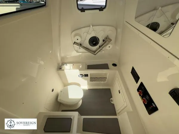 Slide: The Image of 2024 Sailfish 312 boat interior with modern bathroom amenities and sleek design. - 26