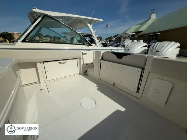 Slide: The Image of 2024 Sailfish 312 boat interior with storage compartments and seating, showcased by Sovereign Yachts. - 27