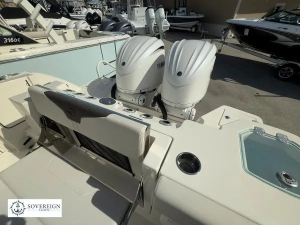 Slide: The Image of 2024 Sailfish 312 boat with dual Yamaha outboard engines, showcased at Sovereign Yachts. - 30