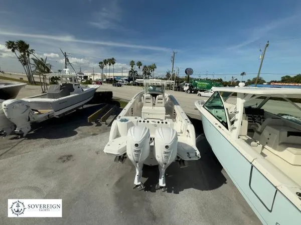 Slide: The Image of 2024 Sailfish 312 boat with dual engines displayed at Sovereign Yachts dealership. - 5