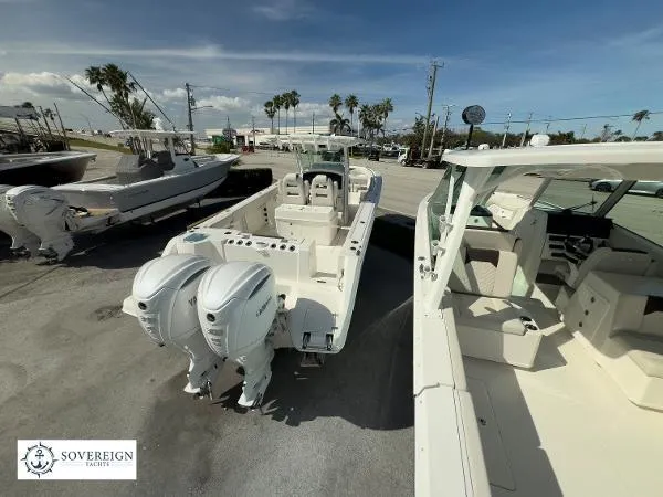 Slide: The Image of 2024 Sailfish 312 boat with dual engines, displayed at Sovereign Yachts dealership. - 6