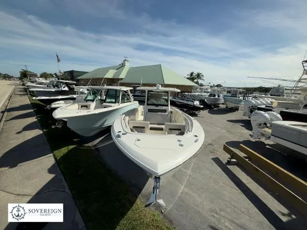 Slide: The Image of 2024 Sailfish 312 boat displayed at a marina, surrounded by other vessels. - 8