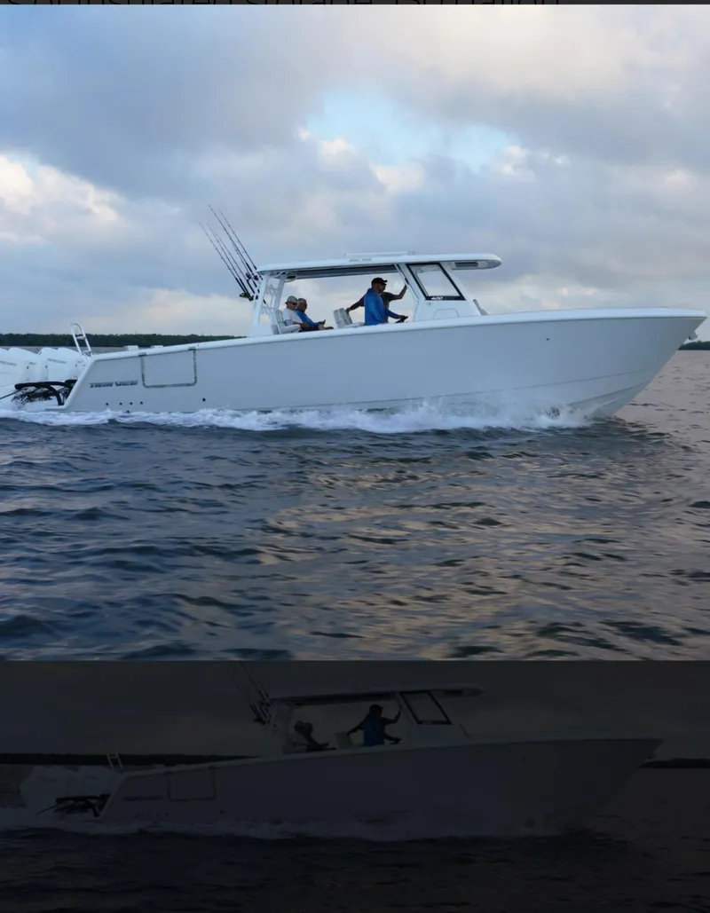 Slide: The Image of 2025 Twin Vee 400 GFX boat cruising on open water. - 1