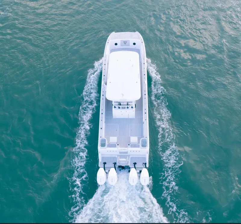 Slide: The Image of Aerial view of 2025 Twin Vee 400 GFX boat cruising on water. - 10