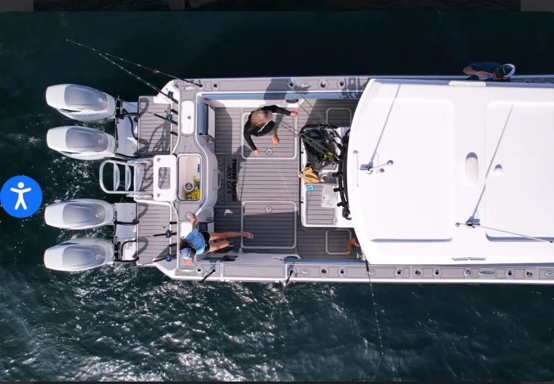 Slide: The Image of Aerial view of 2025 Twin Vee 400 GFX boat with four outboard engines. - 4