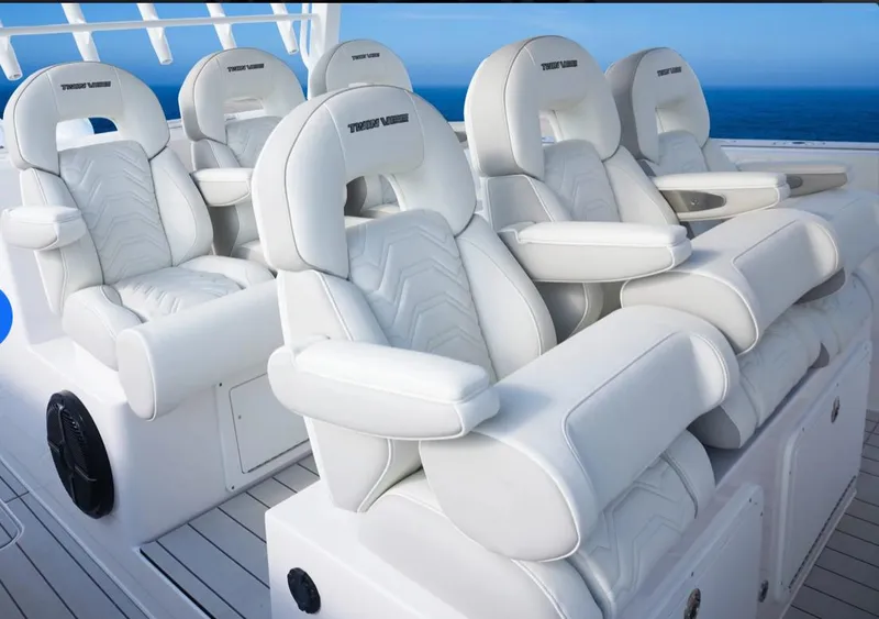 Slide: The Image of Luxurious seating on the 2025 Twin Vee 400 GFX boat with ocean backdrop. - 6
