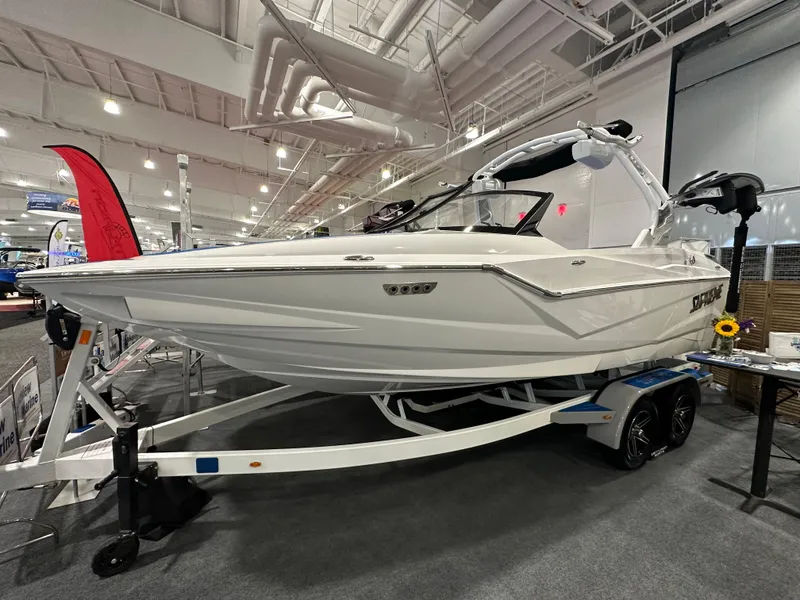 The Image of 2023 Supreme ZS212 boat on display in an indoor showroom. - 0