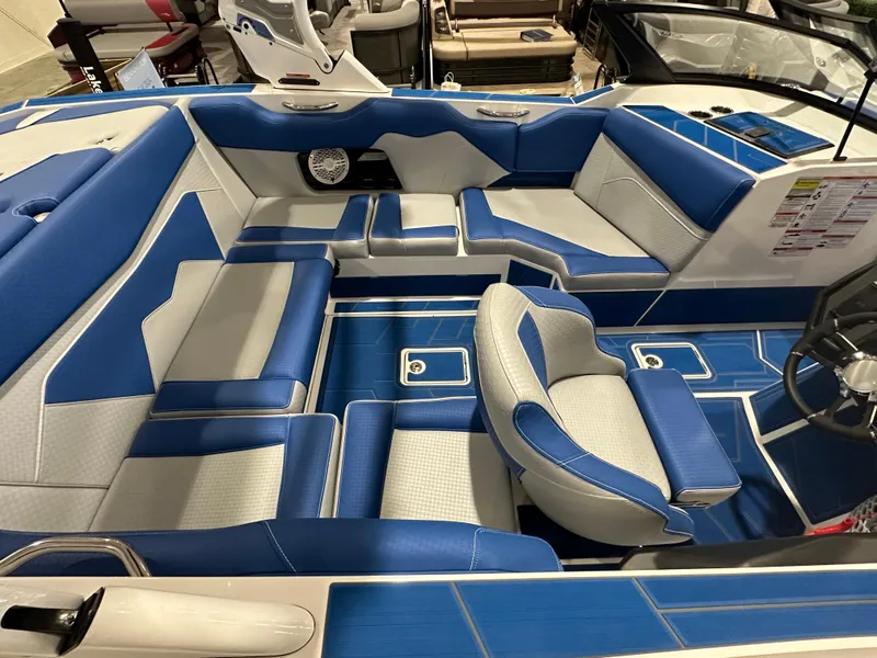 Slide: The Image of 2023 Supreme ZS212 boat interior with blue and white seating, modern design. - 4