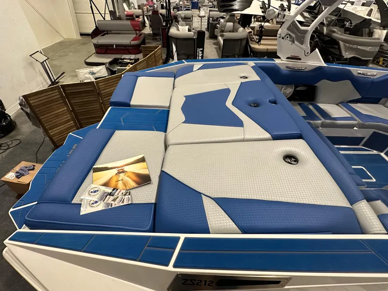 Slide: The Image of 2023 Supreme ZS212 boat with blue and white cushioned seating. - 5
