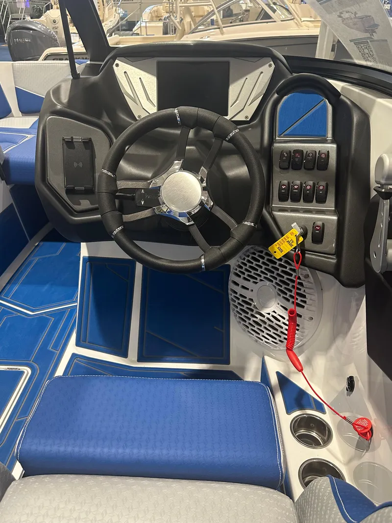 Slide: The Image of 2023 Supreme ZS212 boat cockpit with modern steering wheel and control panel. - 7