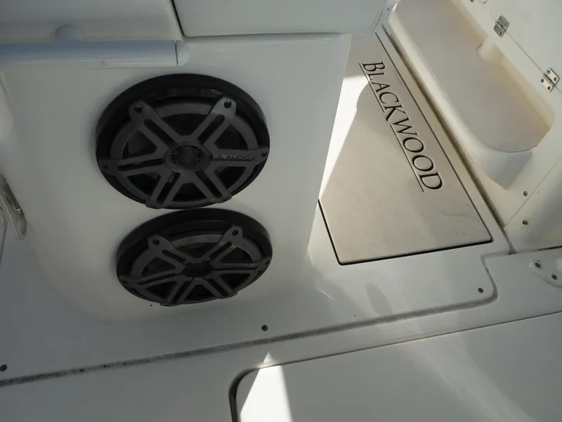 Slide: The Image of 2020 Blackwood 270 Open Center Console boat interior with speakers and branded mat. - 18