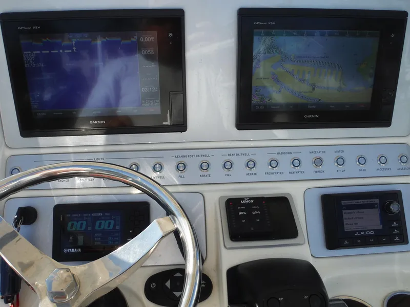 Slide: The Image of Control panel of a 2020 Blackwood 270 Open Center Console boat with Garmin displays. - 24