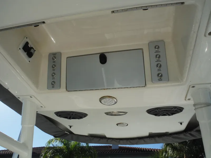 Slide: The Image of 2020 Blackwood 270 Open Center Console boat overhead console with speakers and controls. - 31