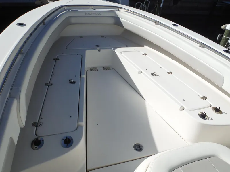 Slide: The Image of 2020 Blackwood 270 Open Center Console boat interior with storage compartments. - 37