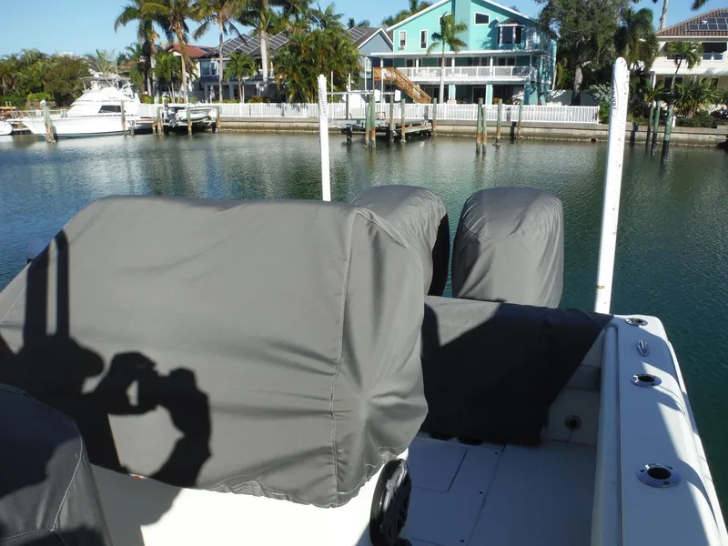 Slide: The Image of 2020 Blackwood 270 Open Center Console boat docked near waterfront homes. - 42