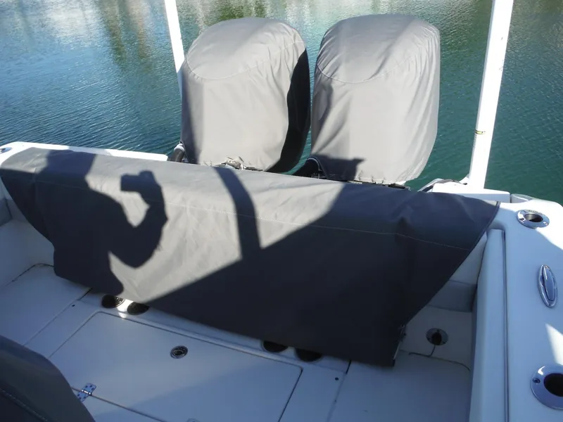 Slide: The Image of 2020 Blackwood 270 Open Center Console boat with covered seats and engines. - 43
