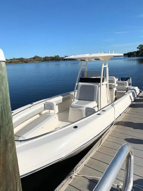 Slide: The Image of 2020 Blackwood 270 Open Center Console boat docked on a sunny day. - 44