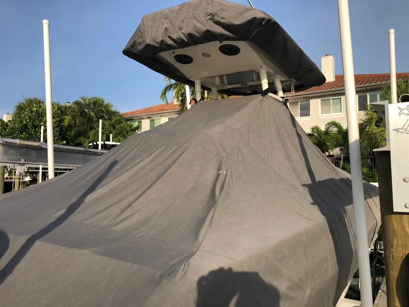 Slide: The Image of 2020 Blackwood 270 Open Center Console boat covered at dock. - 46