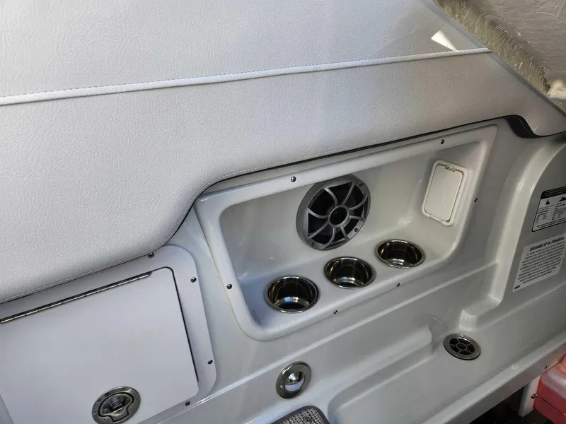 Slide: The Image of Interior detail of 2024 Crownline 280 CRX boat with cup holders and speaker. - 17